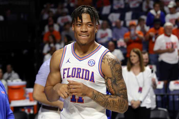 Florida forward Keyontae Johnson (11) smiles after being introduced as a starter before the first half of an NCAA college basketball game against Kentucky, on March 5, 2022, in Gainesville, Fla. Johnson was the Southeastern Conference’s preseason player of the year in 2020-21 but collapsed during a game in December 2020 and hasn’t played since.